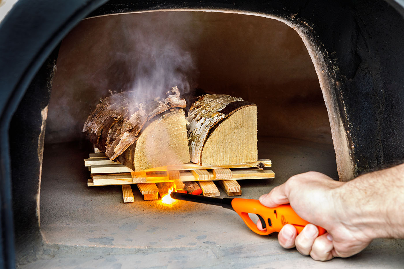 How to light a wood-fired pizza oven